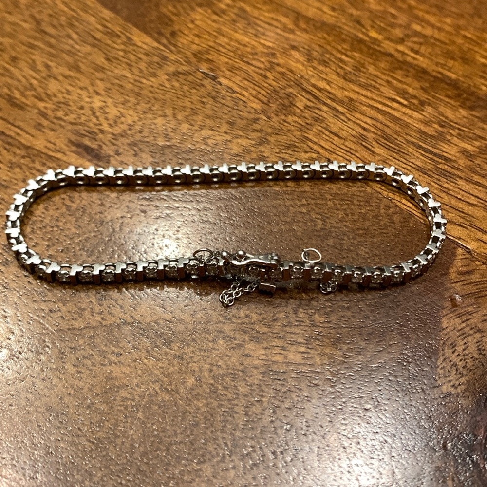 14k white gold tennis bracelet with 60 diamonds.